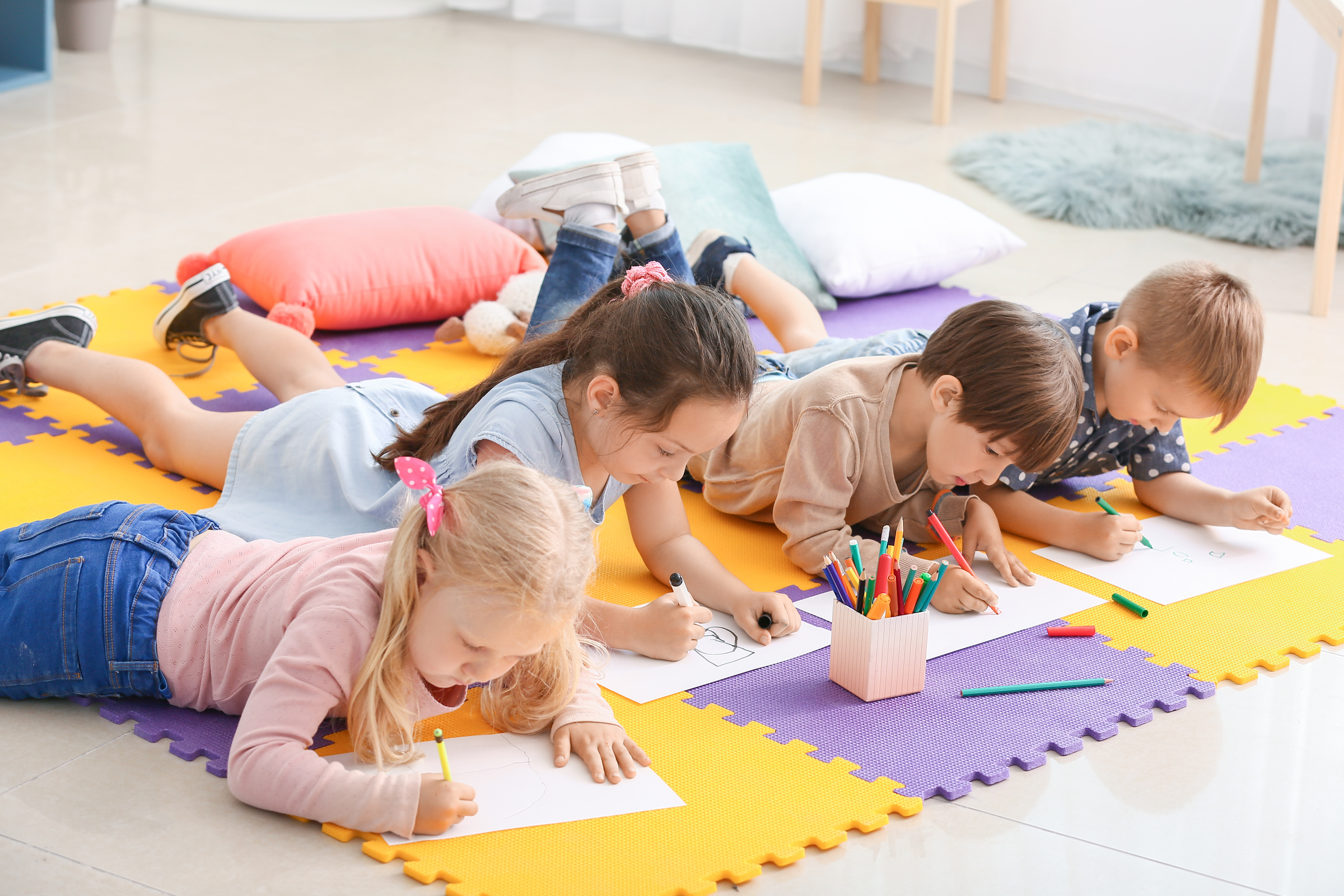Cute Little Children Drawing in Kindergarten